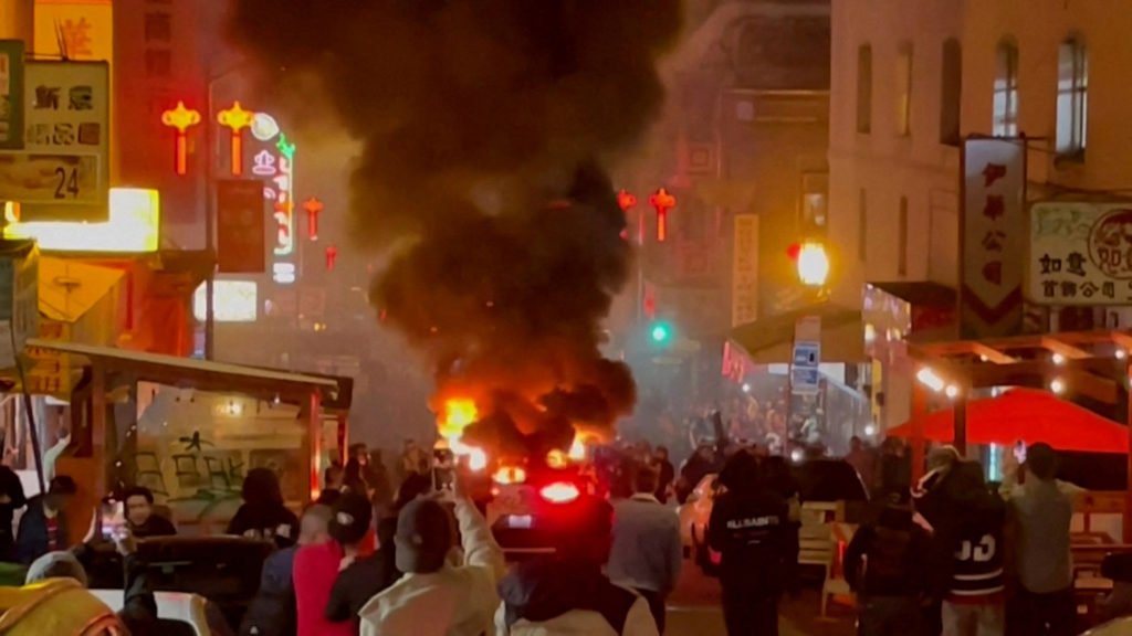 A Waymo self-driving robotaxi, owned by Alphabet's autonomous driving unit, is engulfed in flames after the San Francisco Fire Department said in a statement on social media that fireworks were thrown inside the vehicle, in San Francisco, California February 10, 2024 in a still image from video.  Courtesy of Michael Vandi/ via REUTERS