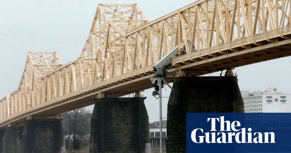 Kentucky firefighter abseils off bridge to rescue dangling truck driver - The Guardian US