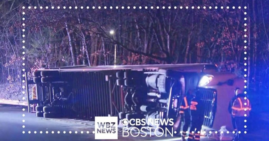 Truck rolls over on Mass Pike ramp in Auburn, spills battery acid - CBS Boston