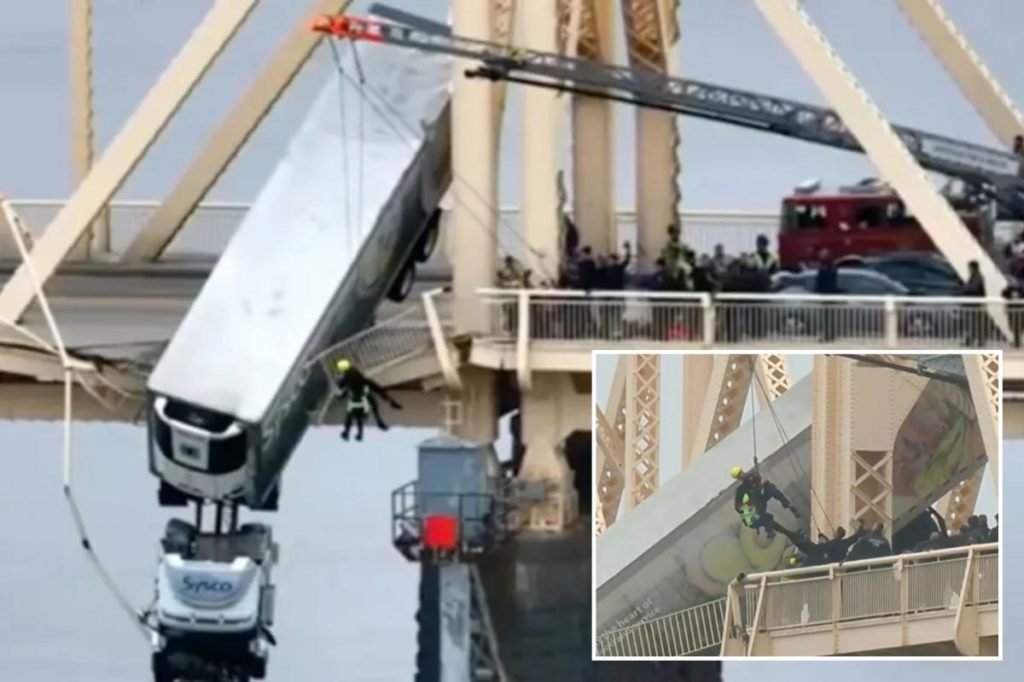 Driver pulled from truck dangling from Louisville bridge over Ohio River in dramatic scene - New York Post