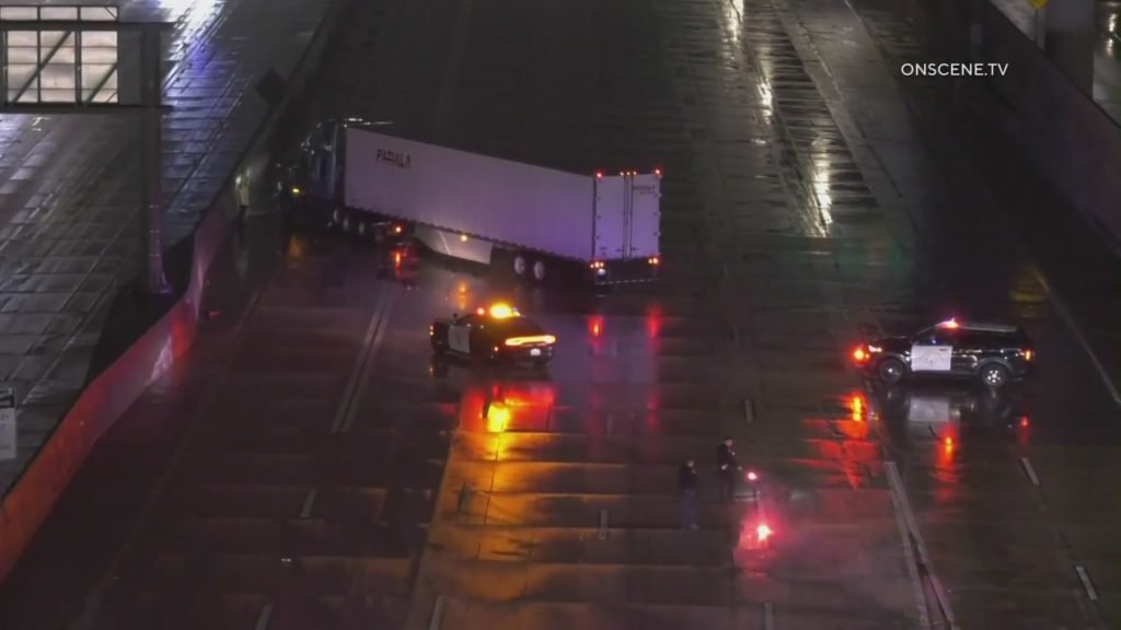 Semi-truck jackknifes on 10 Freeway amid slick conditions - KTLA Los Angeles