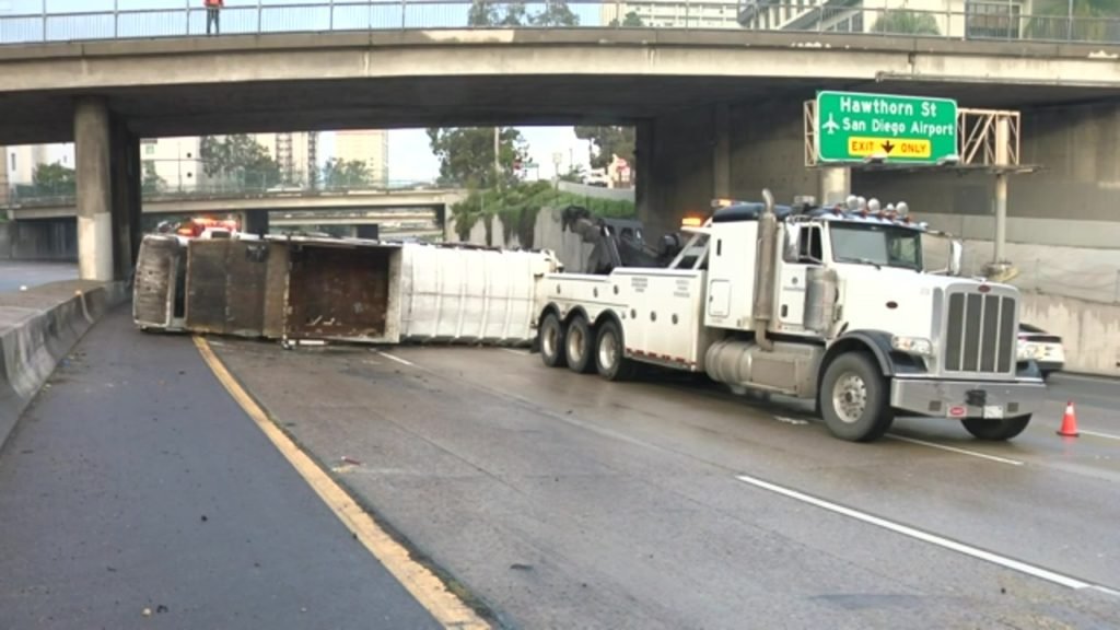 Overturned trash truck jams traffic on I-5 - FOX 5 San Diego