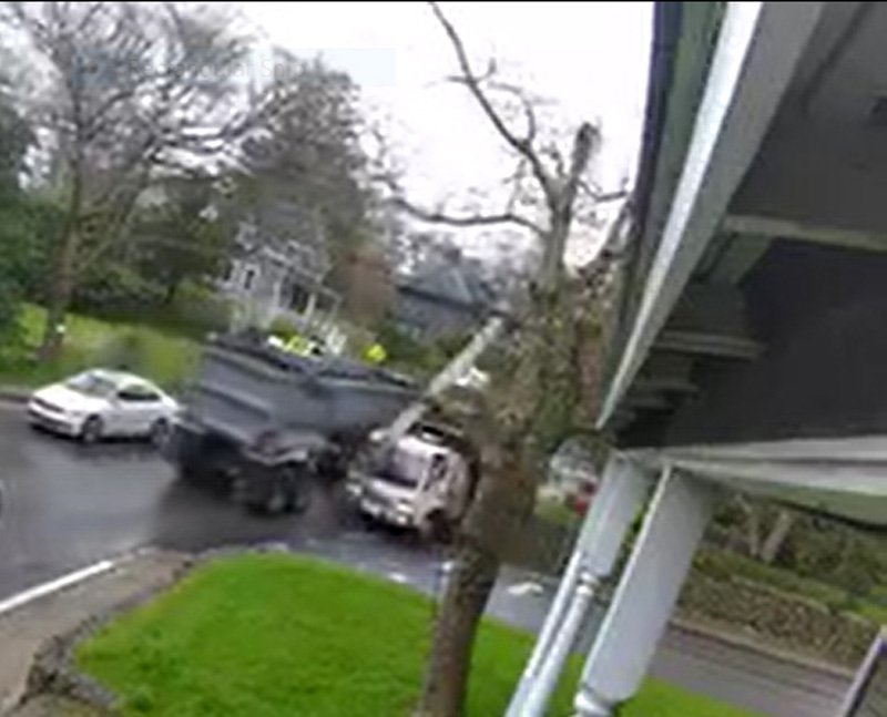 A still from the Tisbury Police Department's footage showing the truck snapping the utility pole.