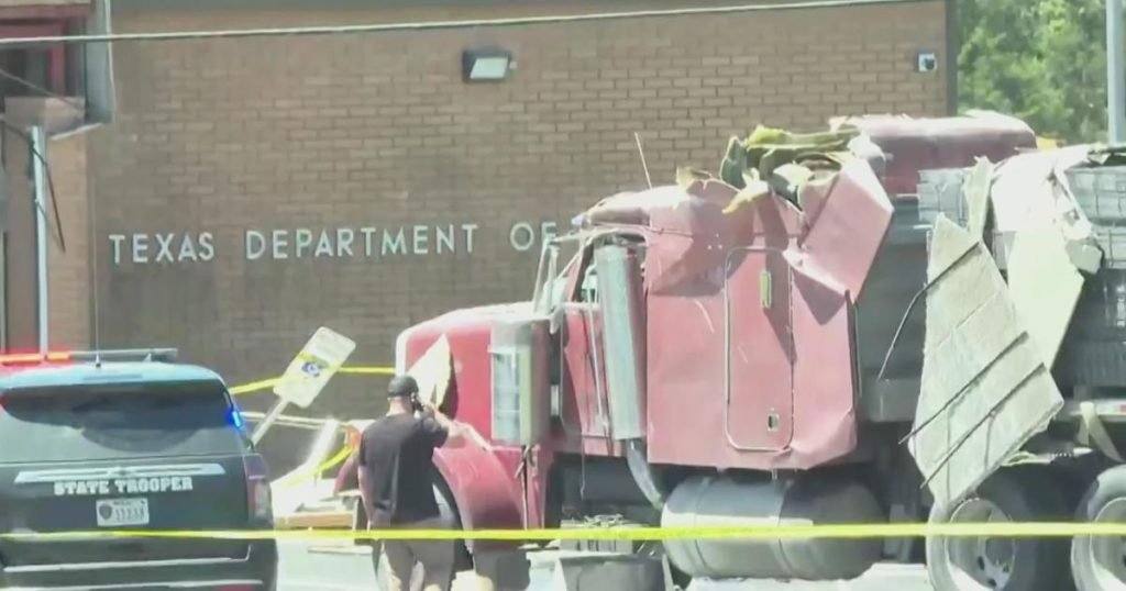 Man arrested for ramming semi-truck into DPS office faces felony charges - CBS News