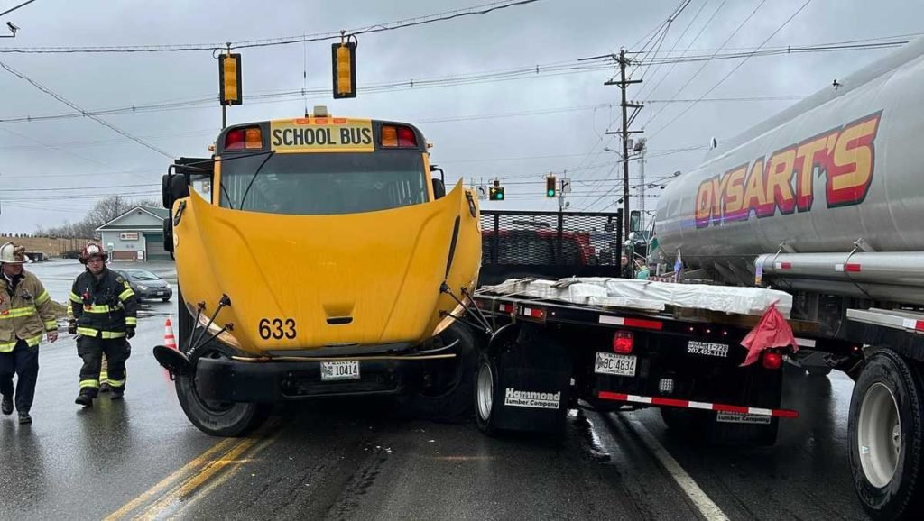 One person hurt when school bus, fuel truck and flatbed truck collide - WMTW Portland