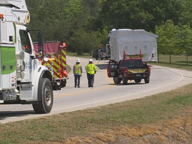 Too tall: House on flatbed truck brings down powerlines, closing Wendell Falls Parkway - WRAL News