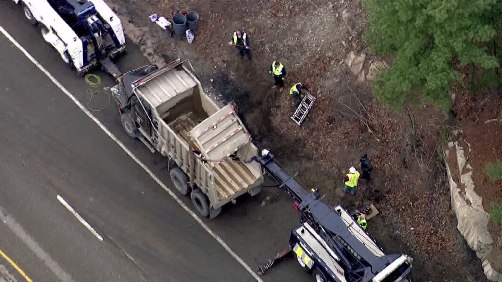 Dump truck rolls over on Mass. highway spilling load onto roadway - WCVB Boston