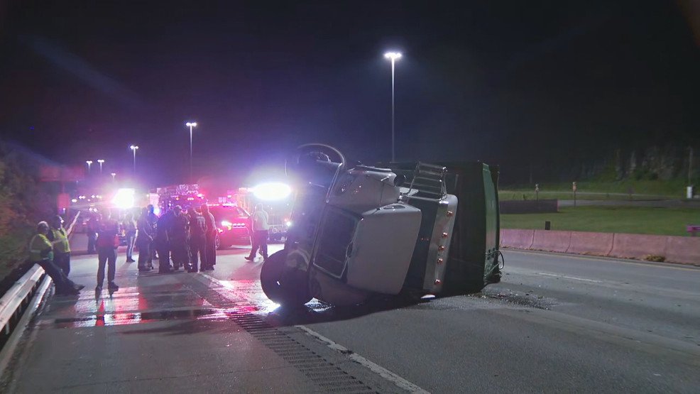 Garbage truck overturns in I-77 crash; charges expected against second driver - WCHS