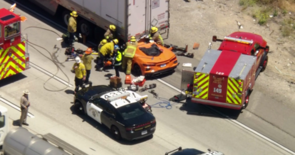 Corvette driver hospitalized after trapped under semi-truck in Castaic - CBS News