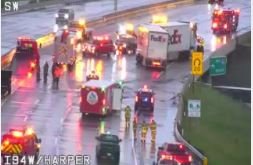Emergency vehicles responded Tuesday evening to a jack-knifed FedEx box truck that forced a temporary shutdown of Interstate 94 near Little Mack Avenue in Clinton Township. (PHOTO -- MICHIGAN DEPARTMENT OF TRANSPORTATION CAMERA)