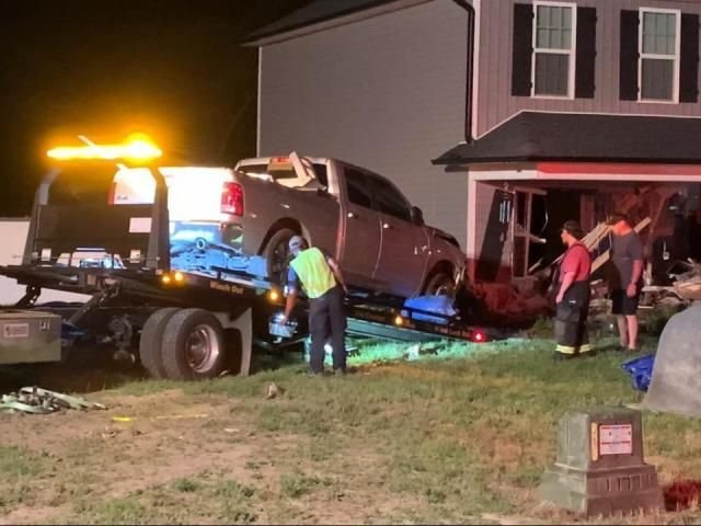 Pickup truck crashes into home in Cumberland County, hits new car in garage - WRAL News