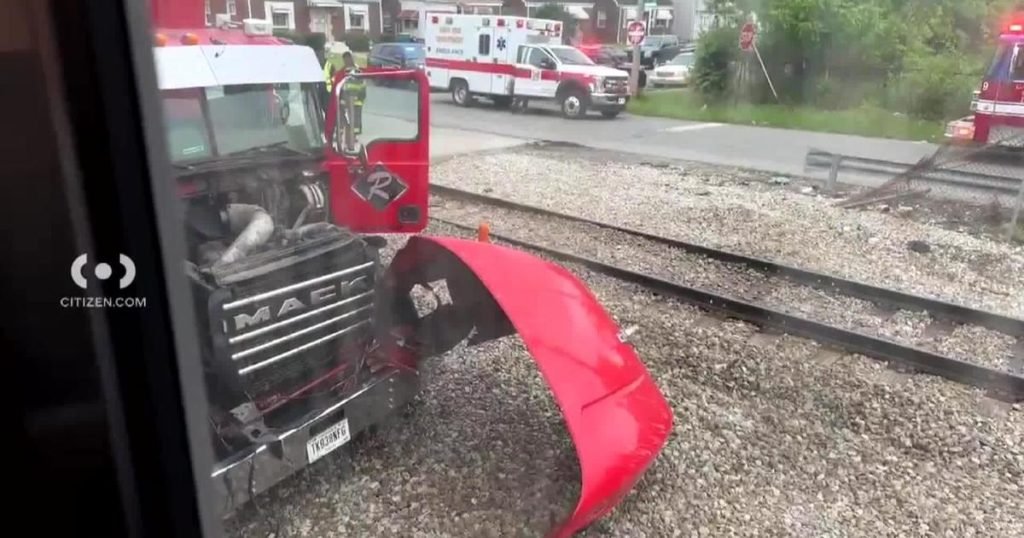 South Shore trains halted after train collides with dump truck - CBS News